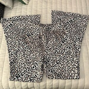 Leopard flares. Never worn